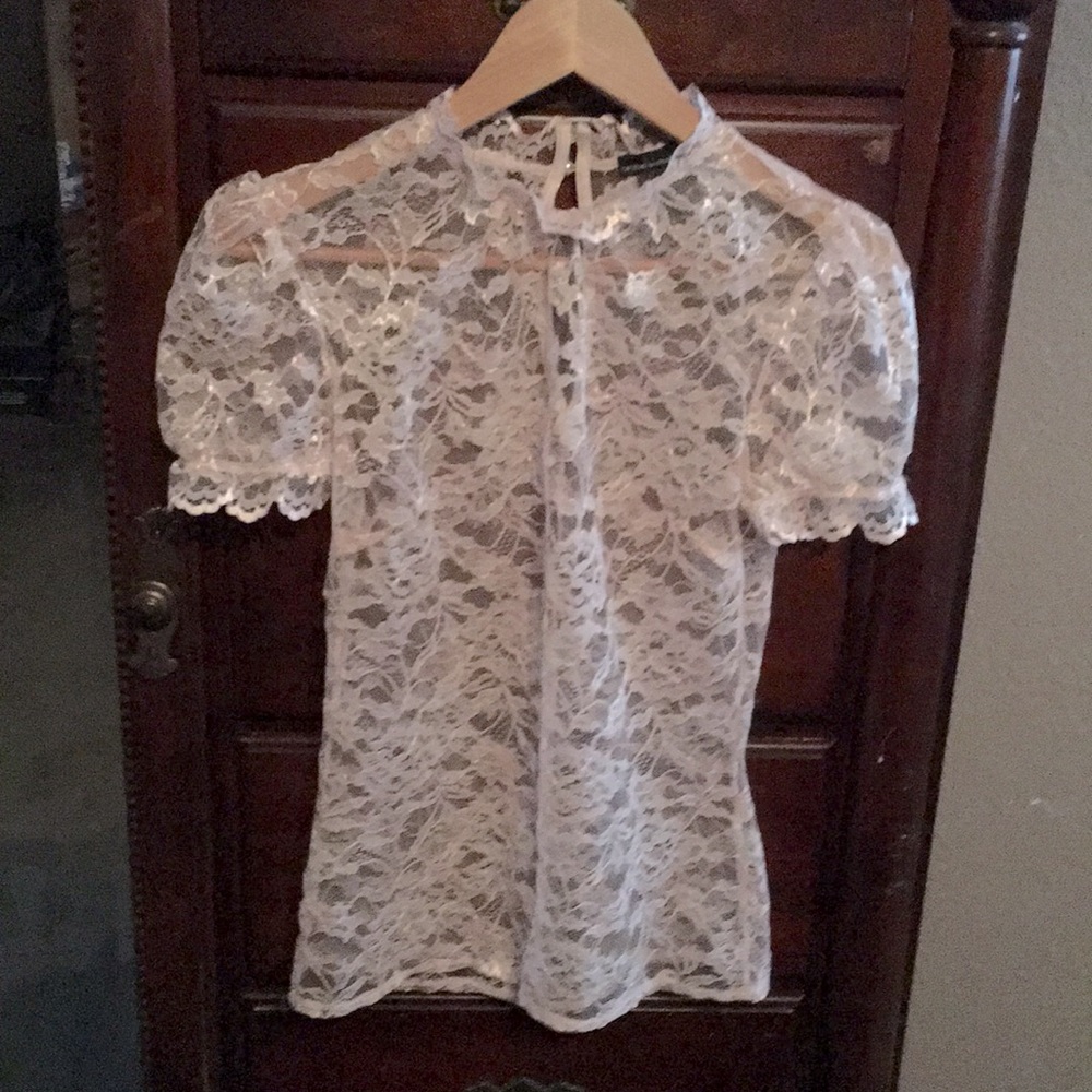 Light pink lace over lady’s shirt